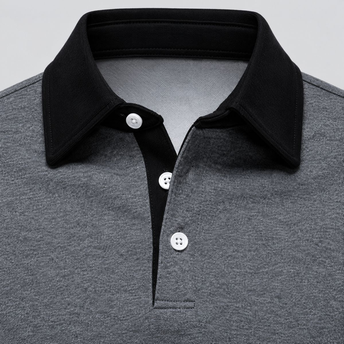 Dark grey polo collar and button detail - enlarged illustration based on supplier image